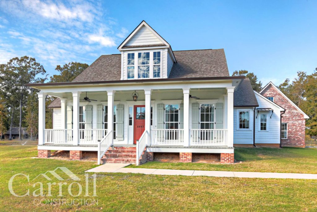 Front Elevation Custom home in the city of Central in East Baton Rouge Parish by Carroll Construction for the Hebert Family. Acadian Farmhouse.