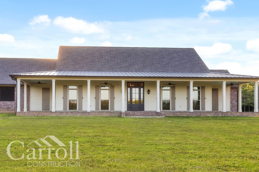 Front Elevation Custom home in the town of Clinton in East Feliciana Parish by Carroll Construction for the Wallace Family. Acadian Farmhouse.