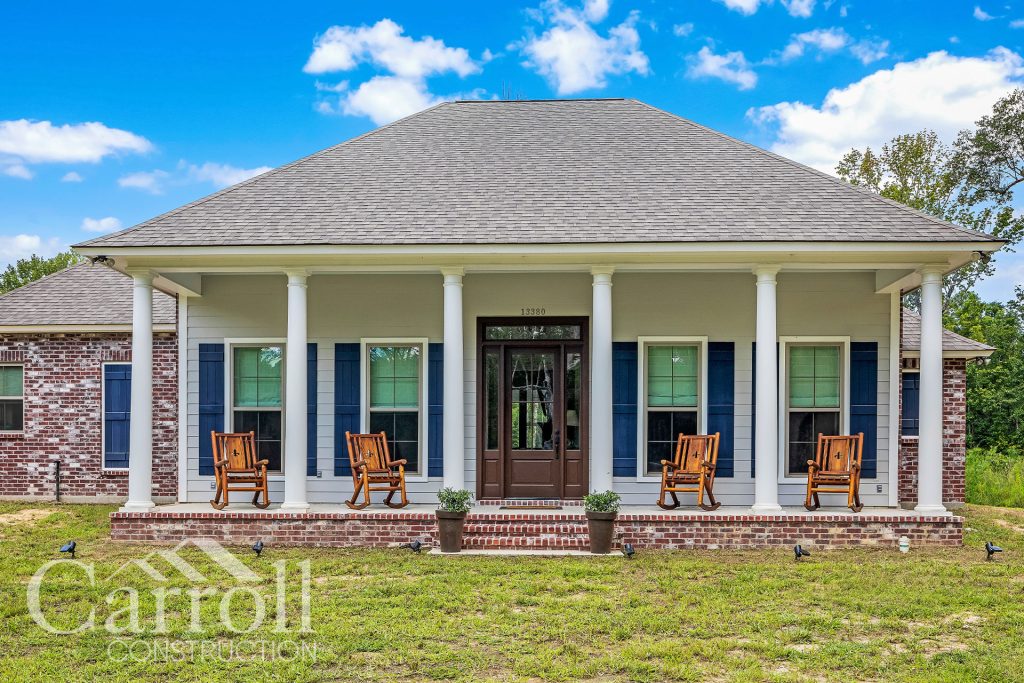 Front Elevation Custom home in East Feliciana by Carroll Construction for the Gehling Family. French Country Style Home.