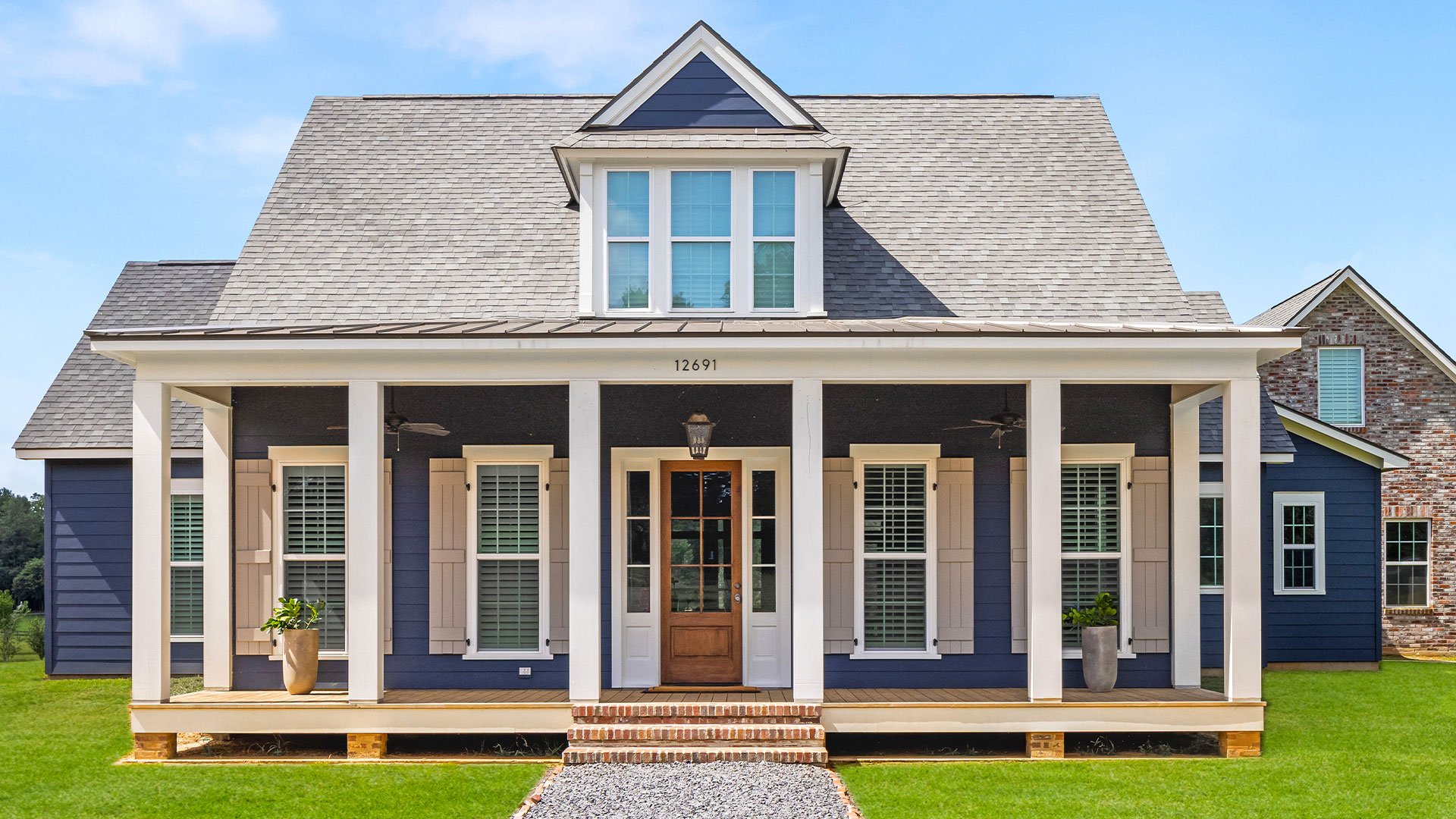 carroll-exterior-1 Front Elevation Custom home in East Feliciana by Carroll Construction for the Carroll Family. Acadian Farmhouse.