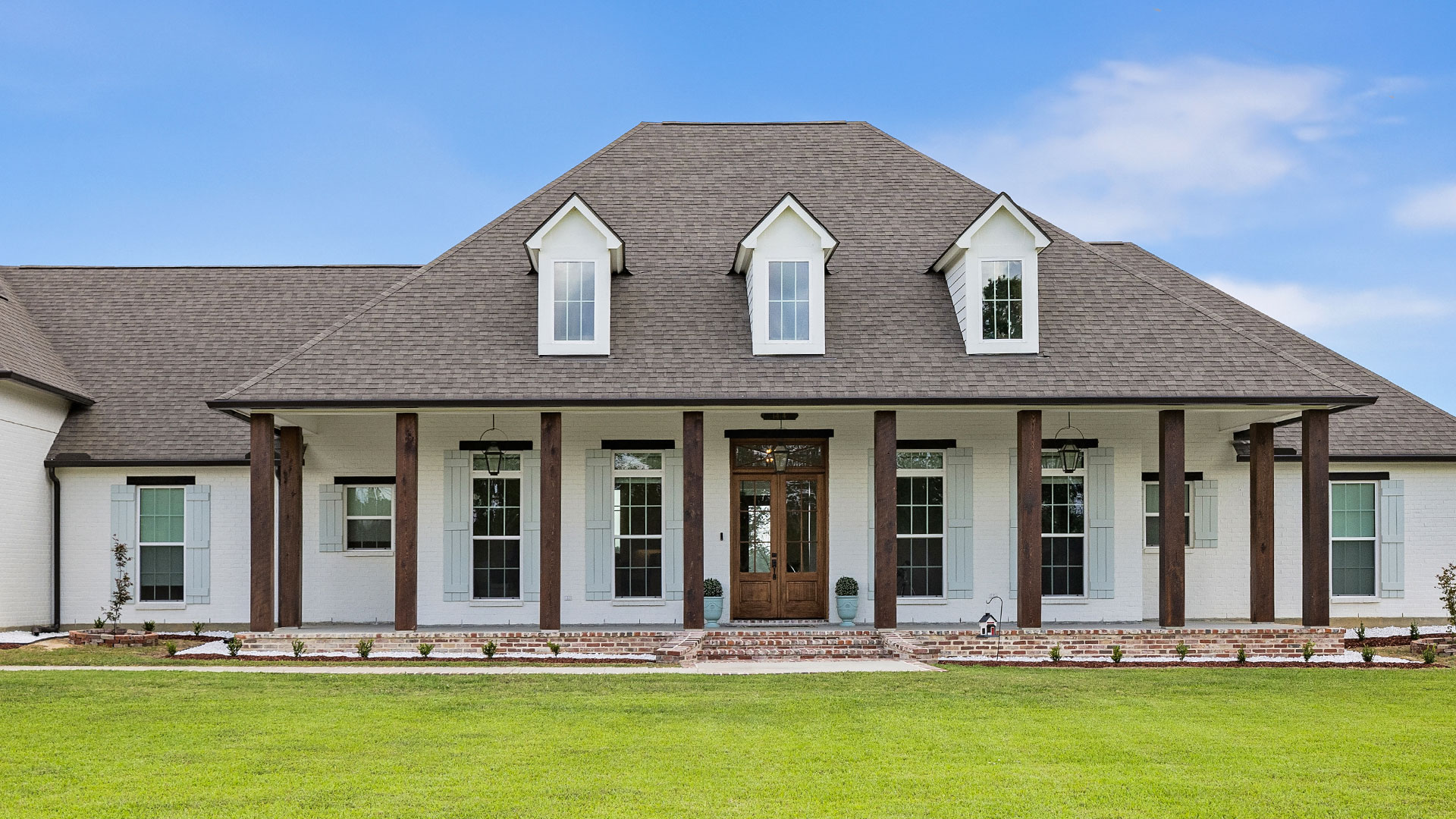 necker-exterior-1 Front Elevation Custom home in East Feliciana by Carroll Construction for the Necker Family. Creole French Style Home.