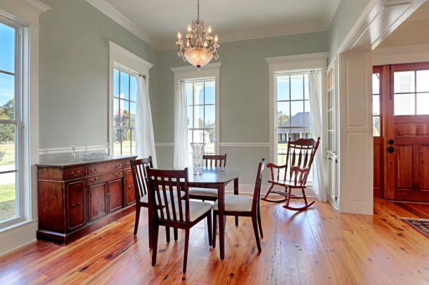 Customized Liberty Plan – Dining room with paneled casement opening and built-in china cabinets