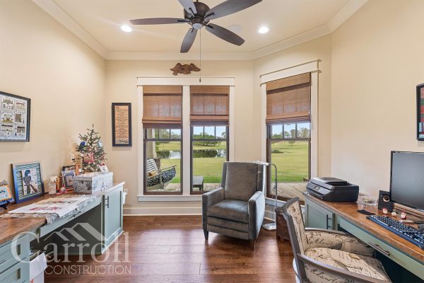 office and craft room in craftsman style home with custom window pediments over vinyl clad wood windows